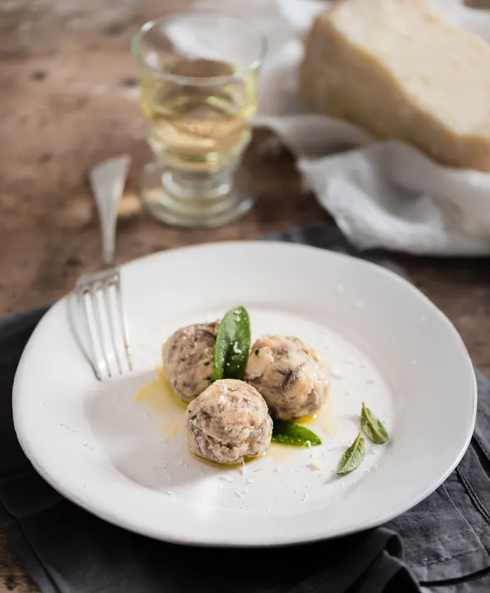 Tyrolean Kaspressknödel cheese dumplings on a plate