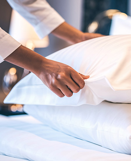 Finely made bed with hotel-quality linen